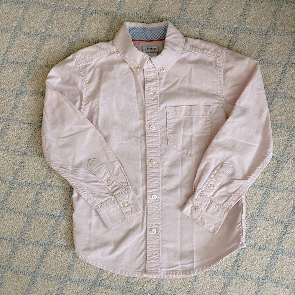 Carter’s light pink shirt